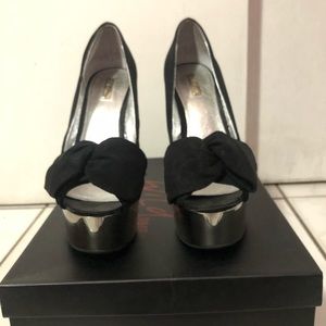 Black platform pumps